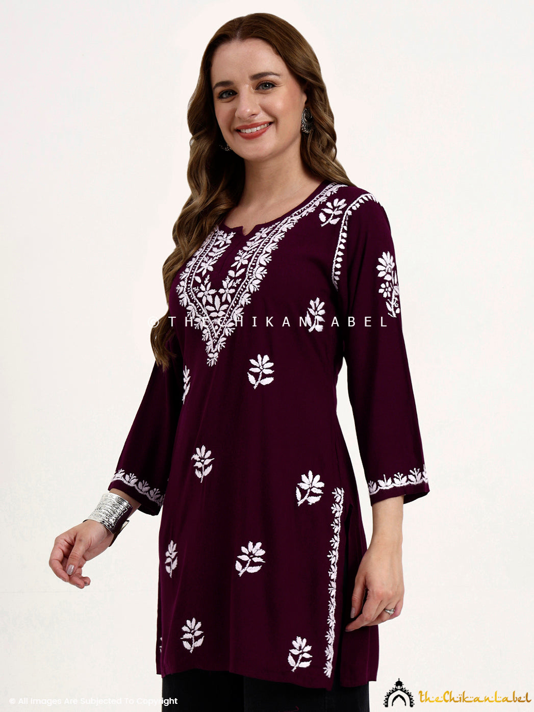 Rayon chikankari short top with floral embroidery crafted by skilled artisans.