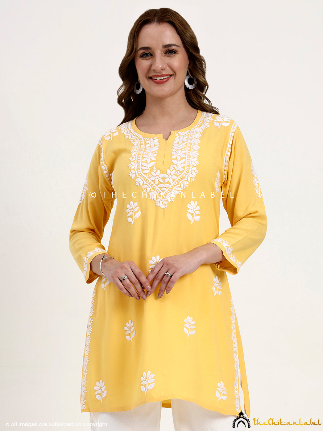 Premium rayon chikankari short top for women with hand embroidery on neckline and sleeves.
