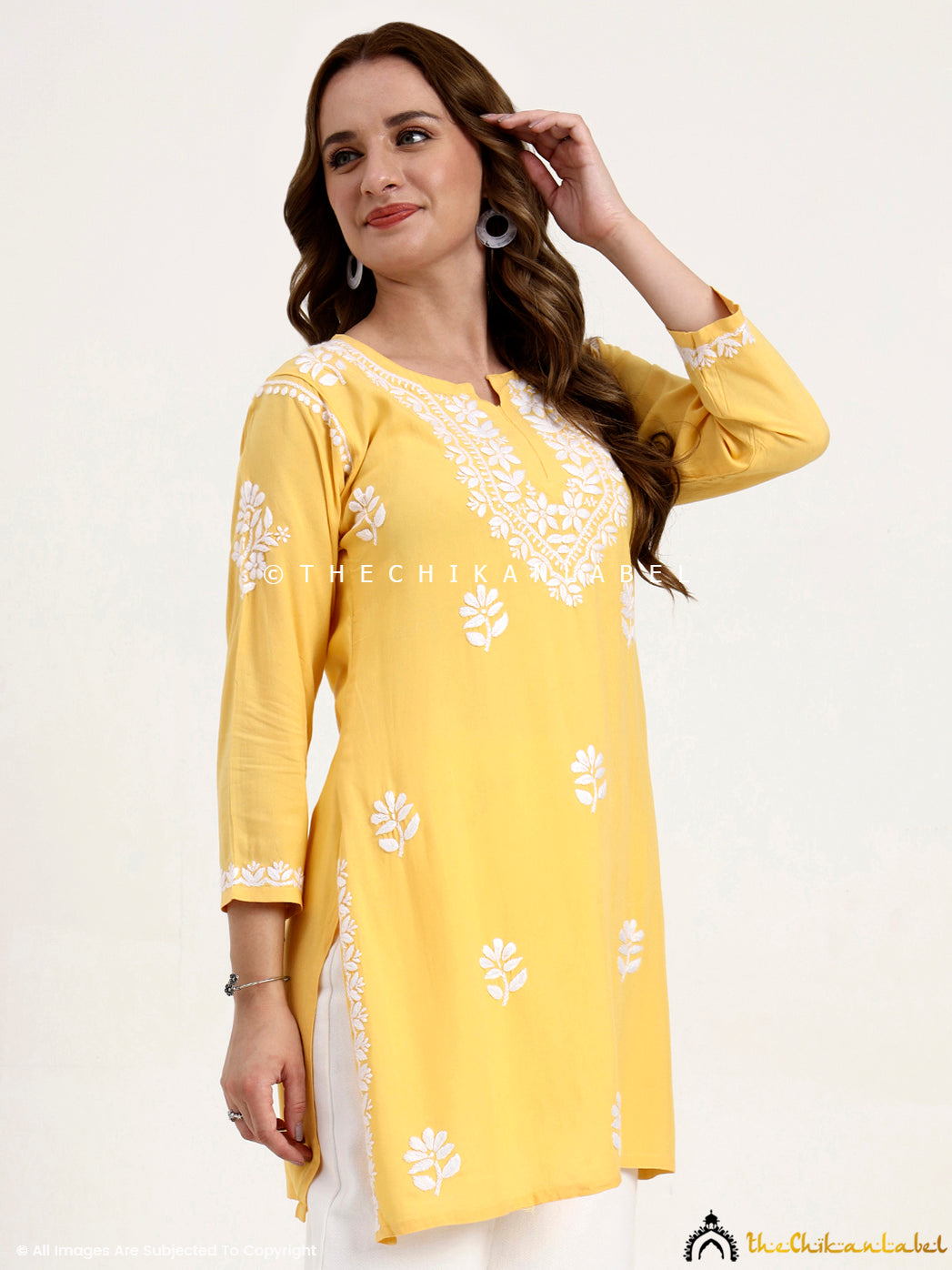 Rayon chikankari short top with intricate thread embroidery and stylish cut.