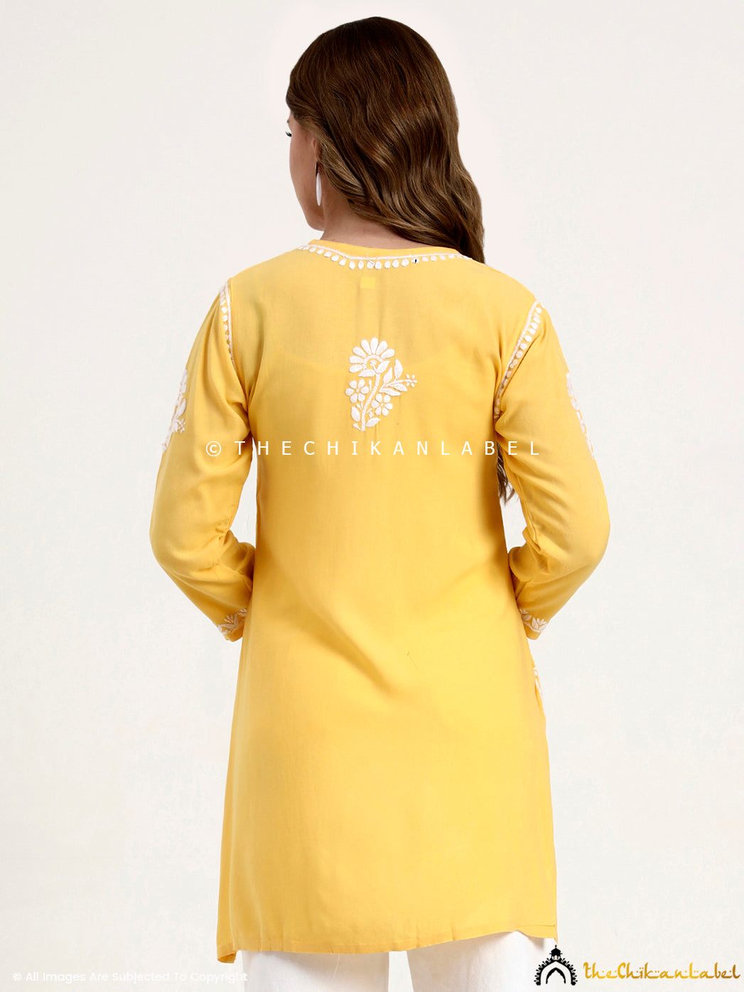 Elegant rayon short top with handcrafted chikankari work ideal for daily wear.