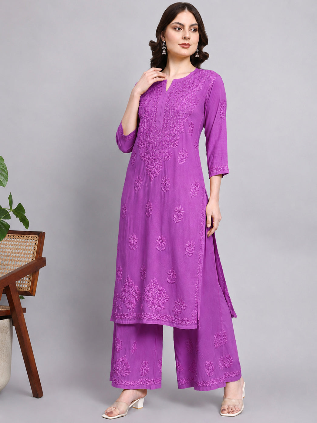 Elegant chikankari kurti palazzo set crafted from lightweight rayon fabric with embroidered neckline, sleeves, front panel and palazzo detailing.