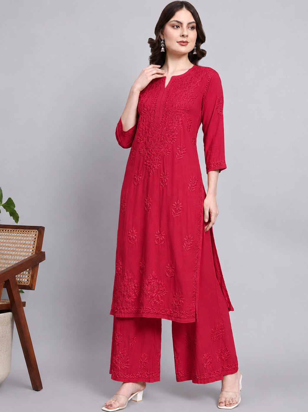 Trending rayon chikankari kurta set for women designed with a straight kurti, three quarter sleeves and matching embroidered palazzo pants.