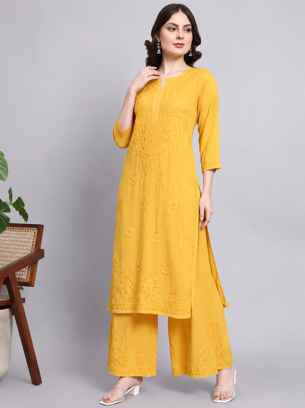 Rayon chikankari kurta set for women with traditional embroidered detailing, comfortable straight fit and matching wide leg palazzo pants.