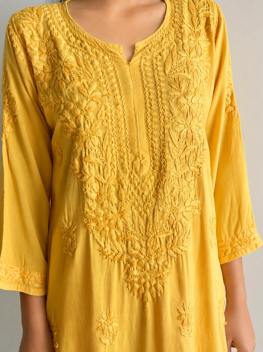 Straight kurti palazzo set for women crafted in soft rayon fabric with detailed chikankari embroidery across the neckline, sleeves, hem and bottoms.