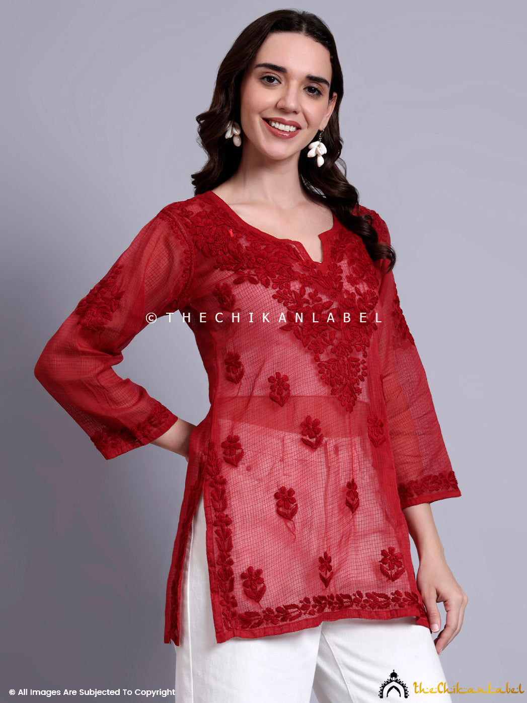 Ethnic short kurta made with lightweight Kota cotton fabric and hand embroidery on chest and hem.

