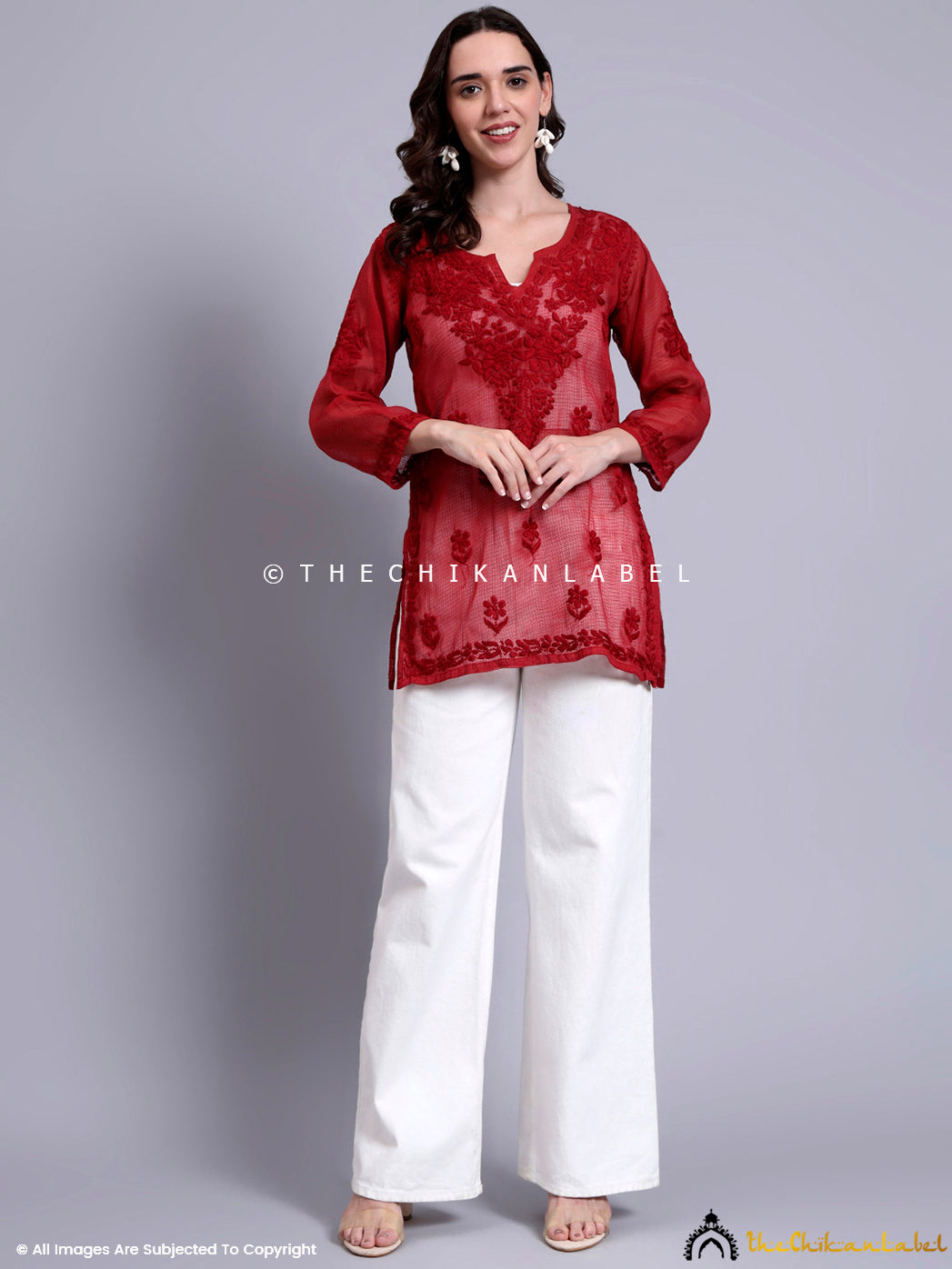 Indian model showcasing Kota cotton short kurti with traditional handcrafted floral embroidery.