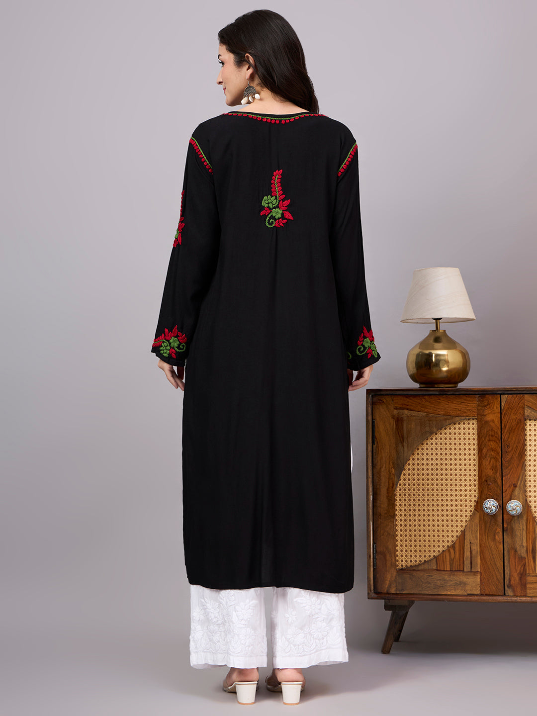 Comfortable regular wear kurti with handcrafted Chikankari embroidery, breathable rayon fabric, classic straight silhouette, and versatile styling for work, travel, and everyday fashion.