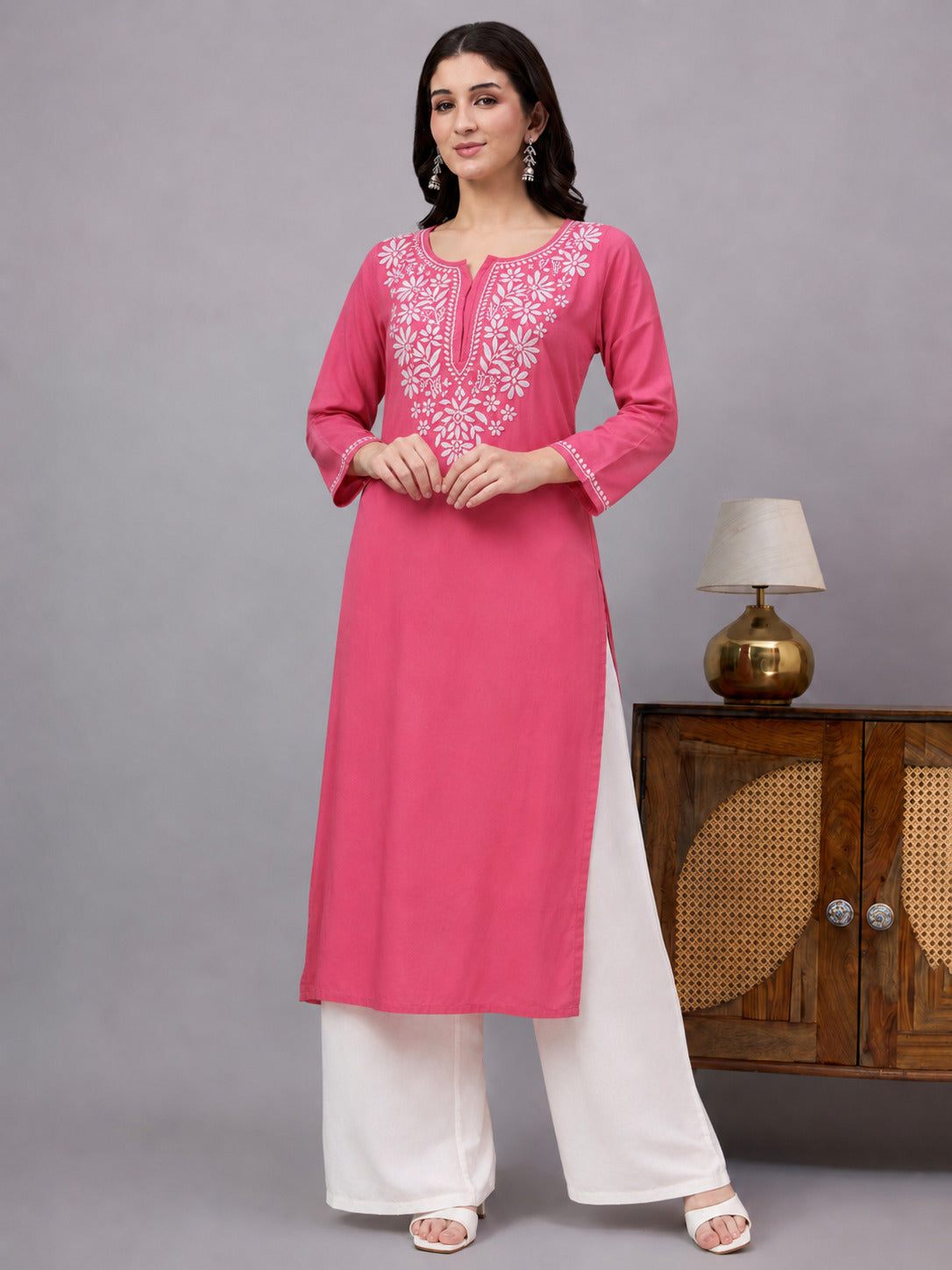 Stylish Chikankari straight kurta with embroidered neckline and sleeve detailing, offering breathable comfort and effortless styling for work, travel, and casual occasions.