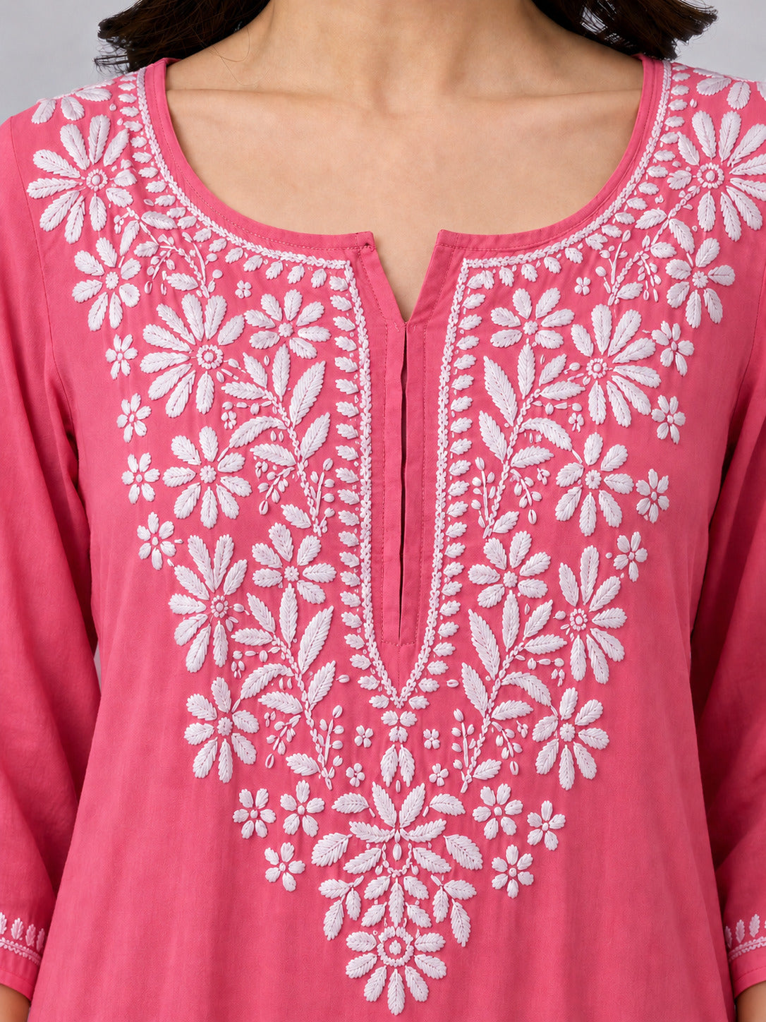 Comfortable regular wear kurti made from breathable rayon fabric featuring handcrafted-inspired Chikankari embroidery and a classic straight-cut design for versatile styling.
