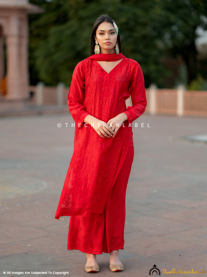 Woman wearing red Chikankari muslin kurta set with dupatta