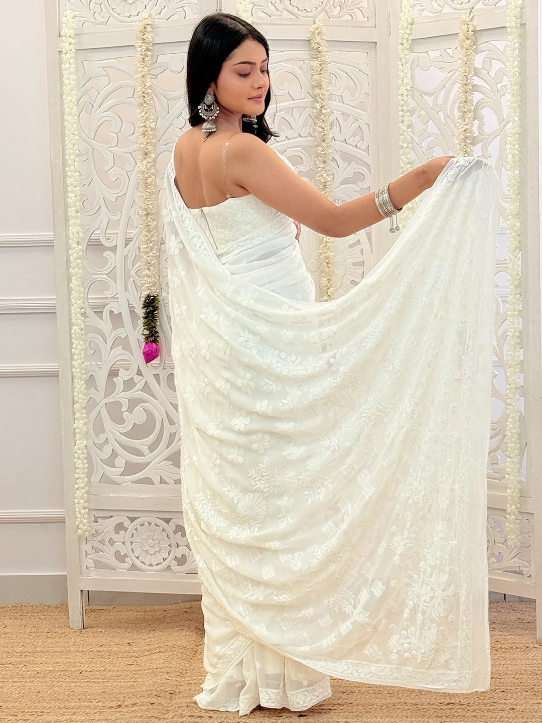 Lightweight viscose festive wear saree with authentic Lucknowi chikankari craftsmanship and intricate border design.