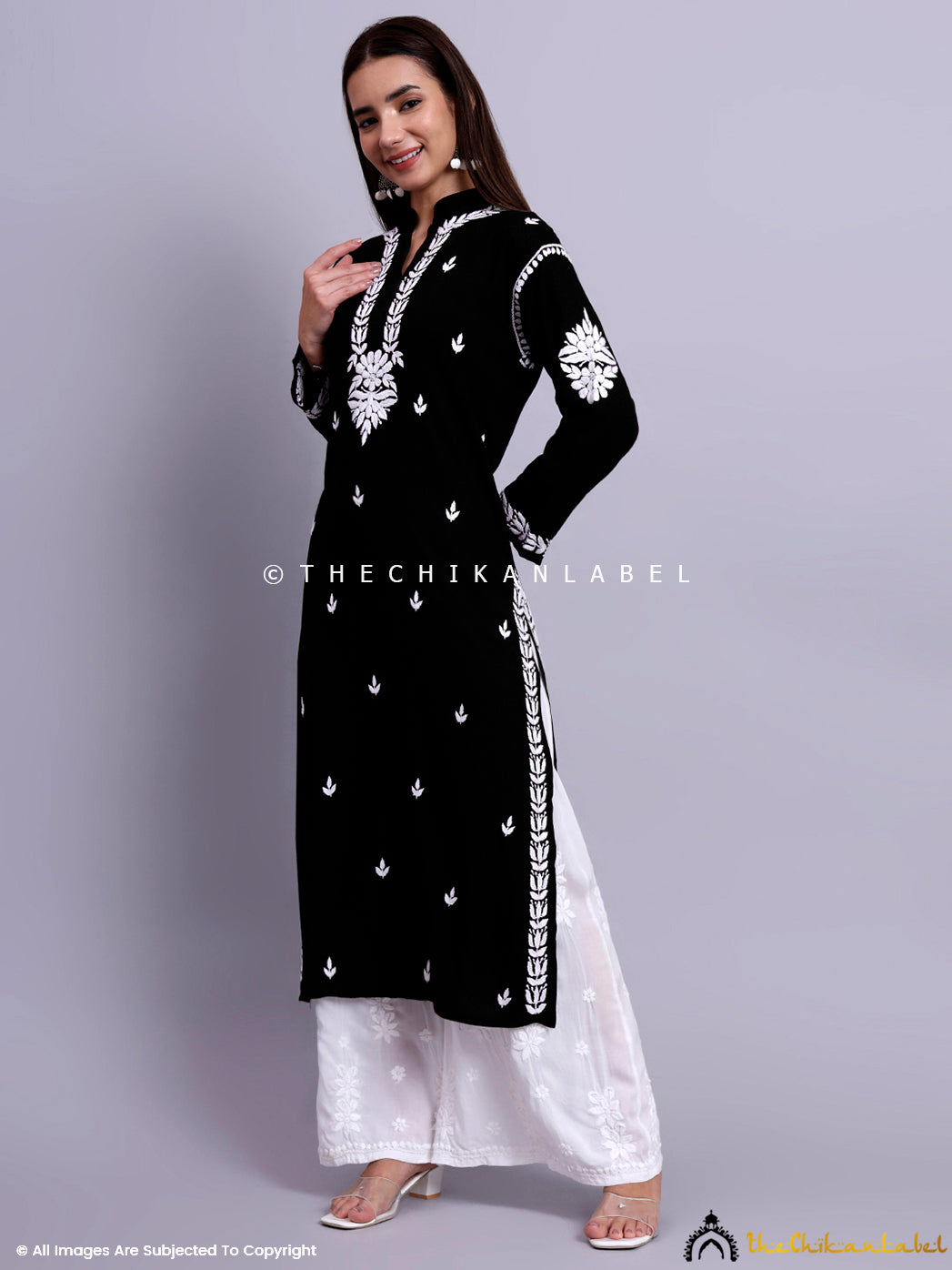 Woman dressed in a handcrafted straight chikankari kurti ideal for professional and casual ethnic looks.

