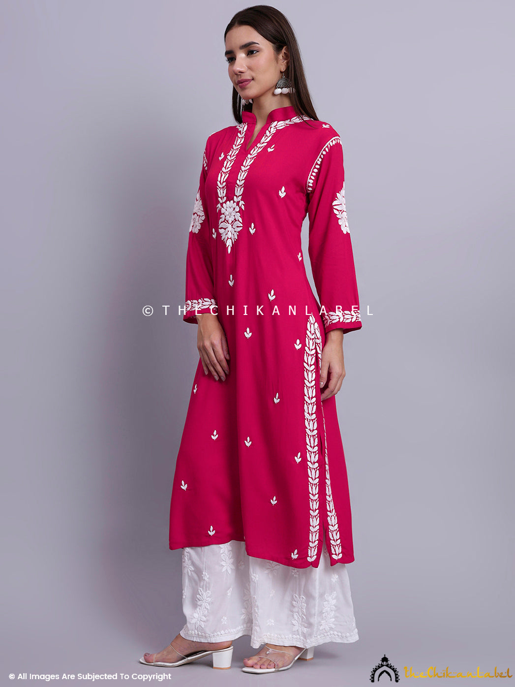 Traditional straight kurti with neckline detailing and floral chikankari motifs for festive dressing.

