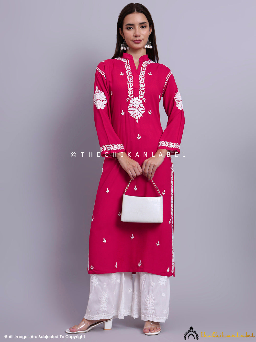 Authentic straight kurti featuring fine embroidery techniques and ethnic design details.

