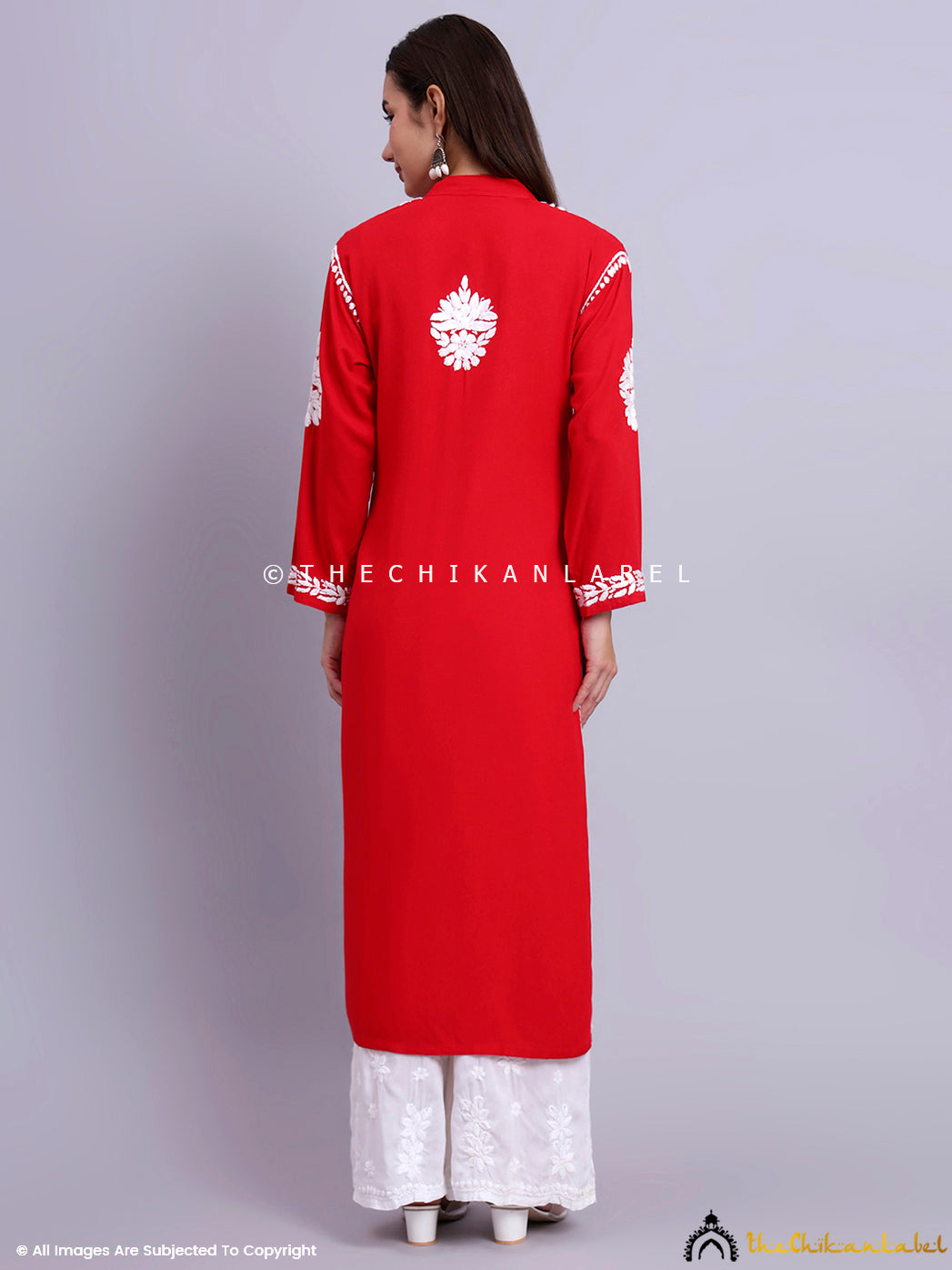 Elegant women’s straight kurti with artisanal chikankari work and modest neckline design.

