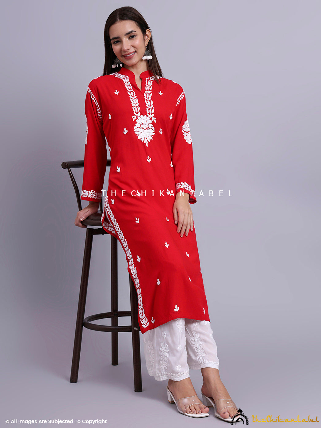 Long rayon chikankari kurti with full sleeves and minimalistic mandarin neckline design.

