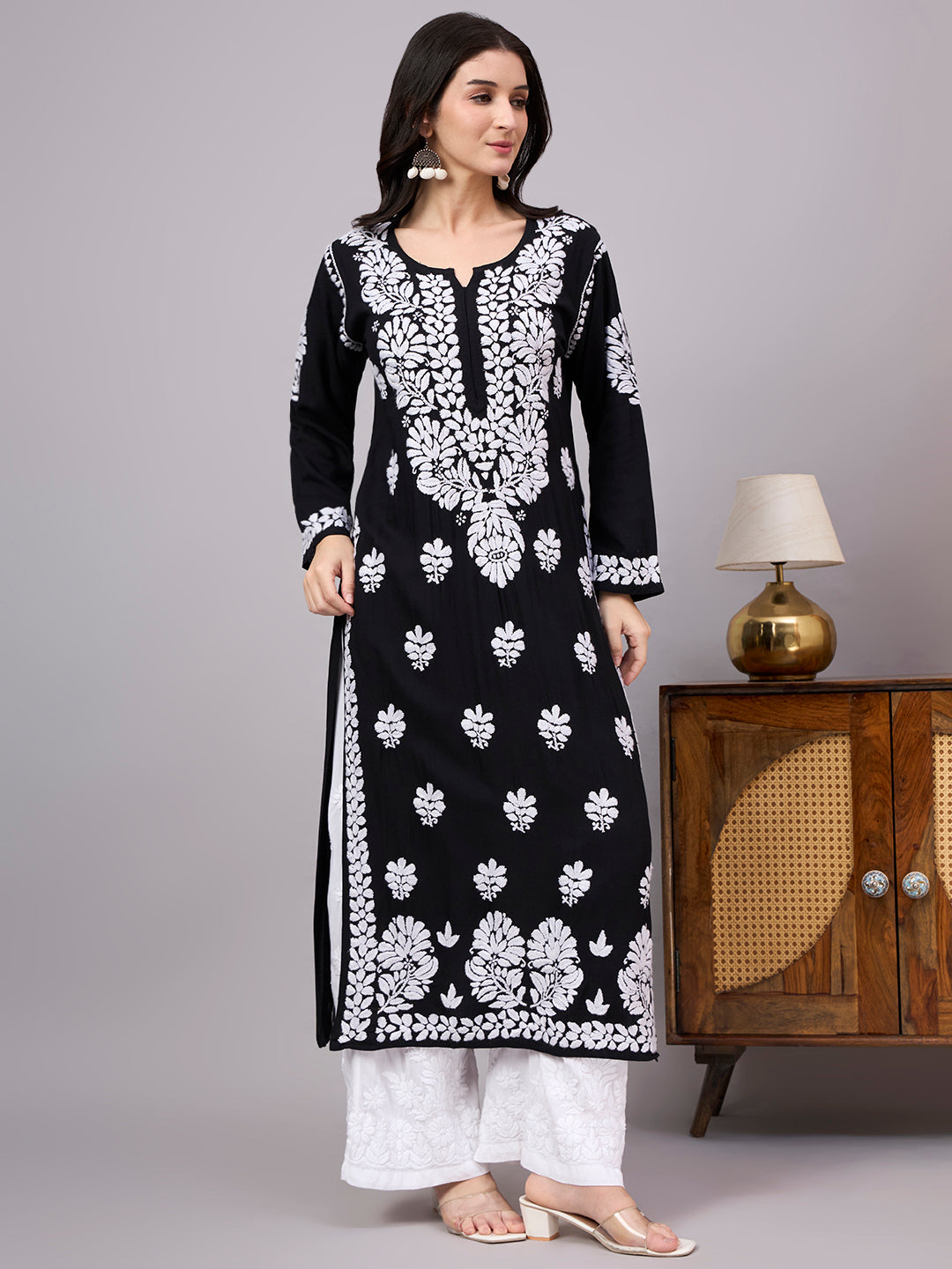 Comfortable regular wear kurti with handcrafted Chikankari embroidery, breathable rayon fabric, classic straight silhouette, and versatile styling for work, travel, and everyday fashion.