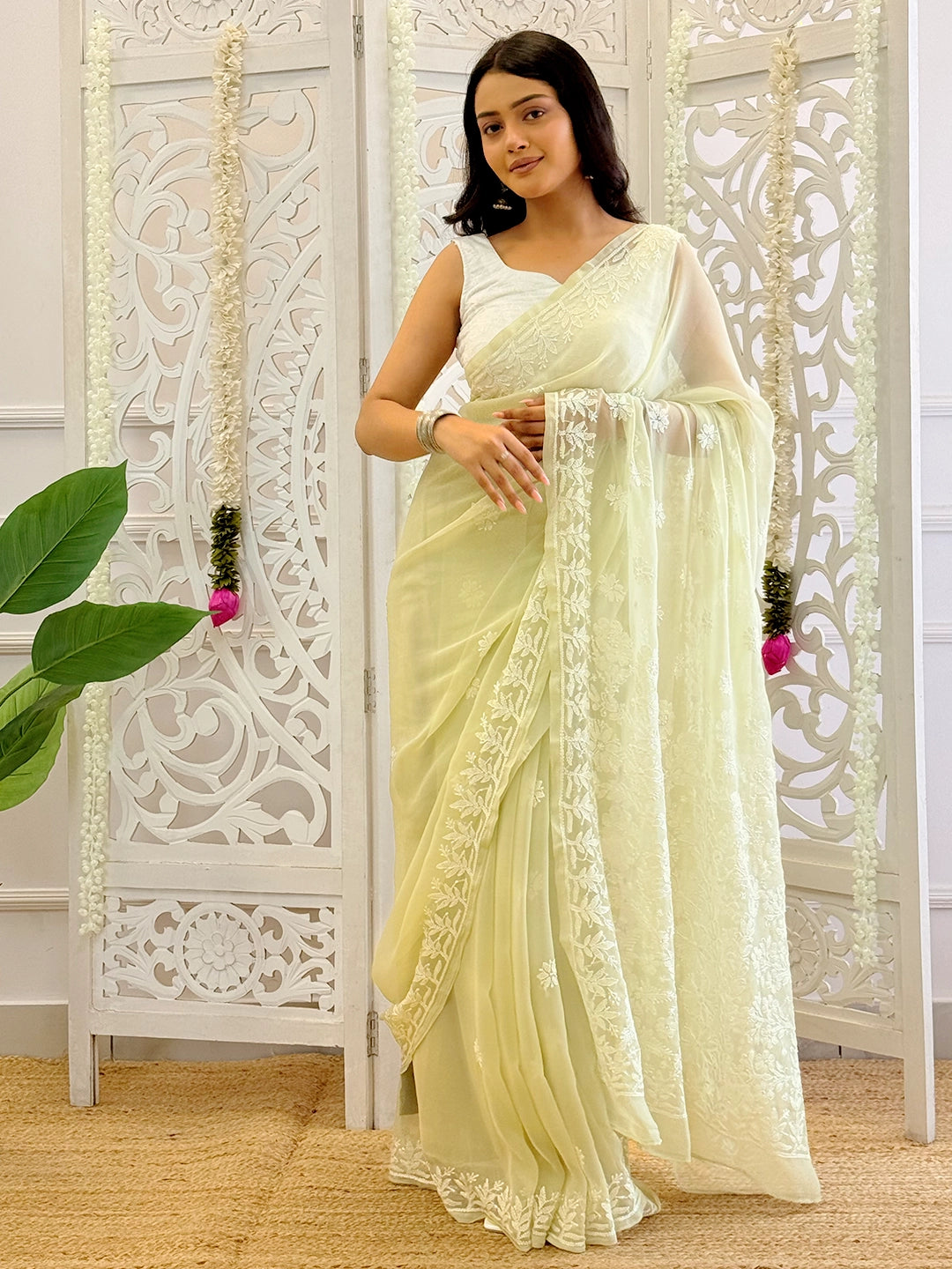 Handcrafted georgette chikankari saree with traditional motifs and fine embroidery details.