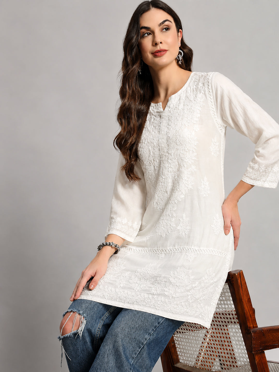 Trending short kurti for women featuring handcrafted Lucknowi-inspired embroidery, graceful silhouette, and contemporary Indian fashion design