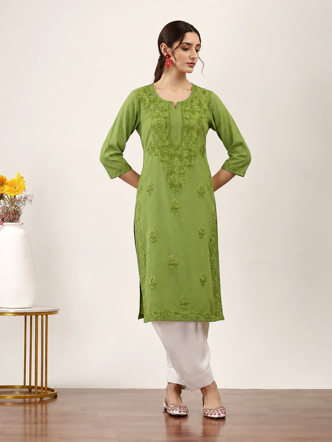 Traditional Chikankari kurti with floral embroidered motifs across the front and body, designed with a comfortable straight fit for everyday wear