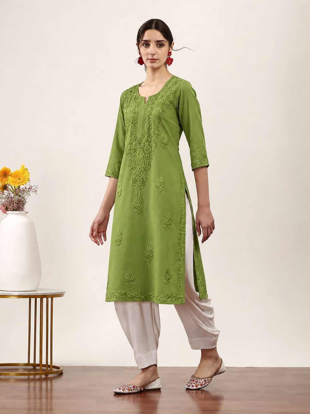 Trendy Chikankari kurti for women with delicate embroidered floral motifs, round neck, three-quarter sleeves and an elegant straight-cut silhouette