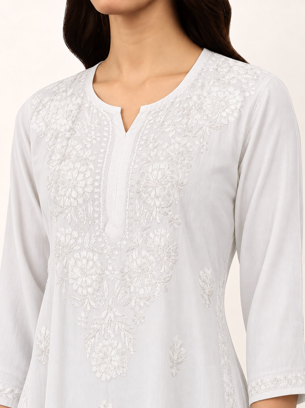 Beautiful Chikankari kurti for women with intricate floral motifs, embroidered front panel, comfortable rayon fabric and contemporary straight kurta silhouette