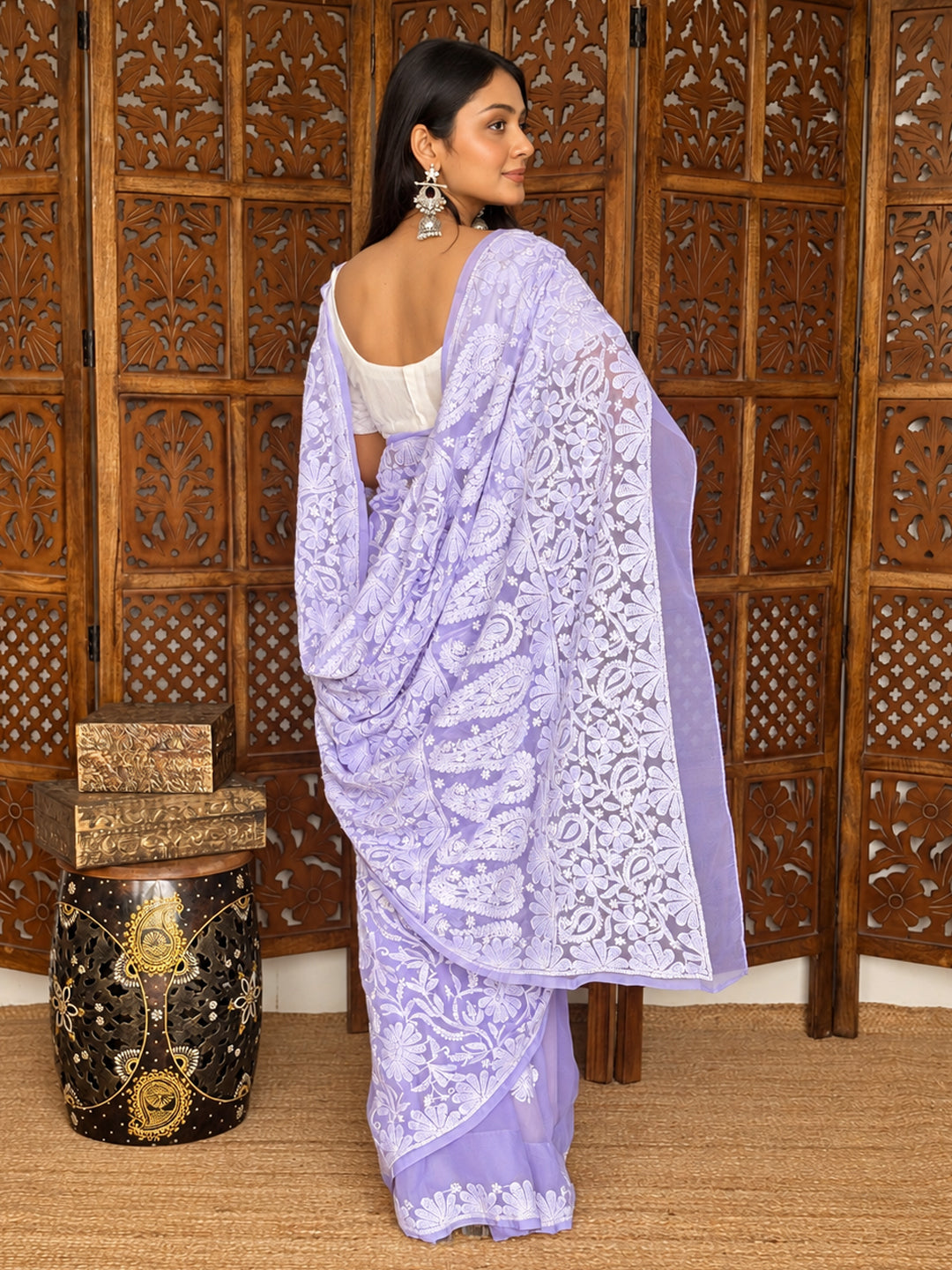 Full-length view of the Sahira Chikankari saree featuring sheer georgette fabric, detailed floral embroidery and decorative borders along the flowing drape.