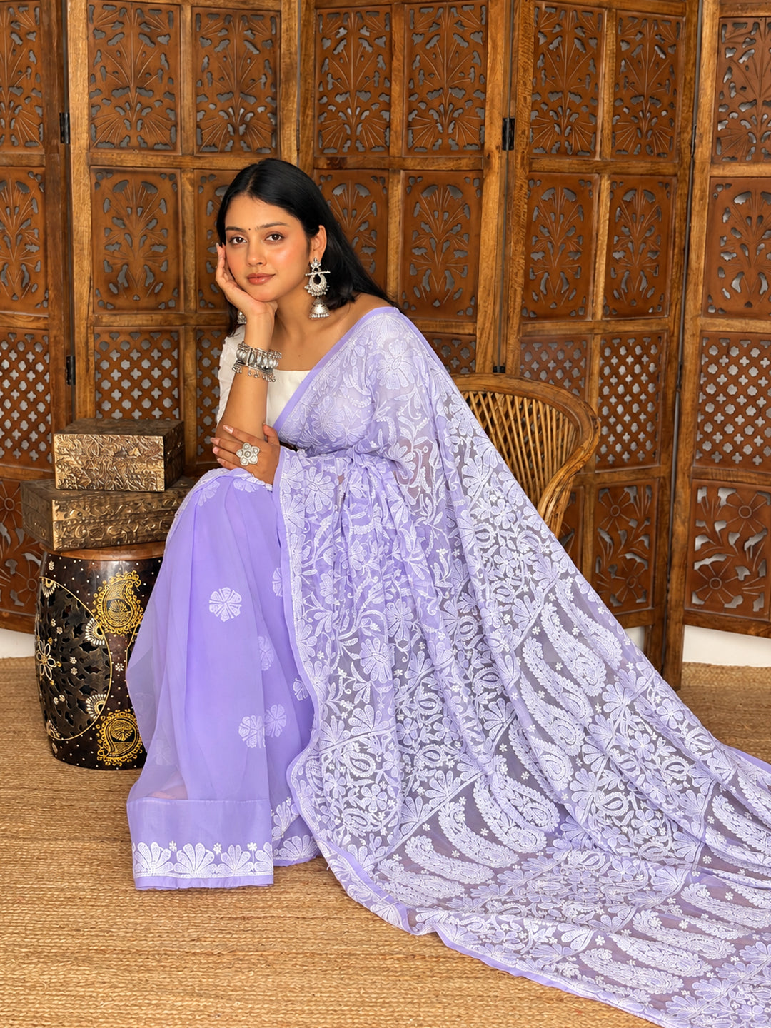 Model presenting the Sahira Georgette Half Jaal Saree with the pallu draped over one shoulder and extended to reveal its intricate embroidery.