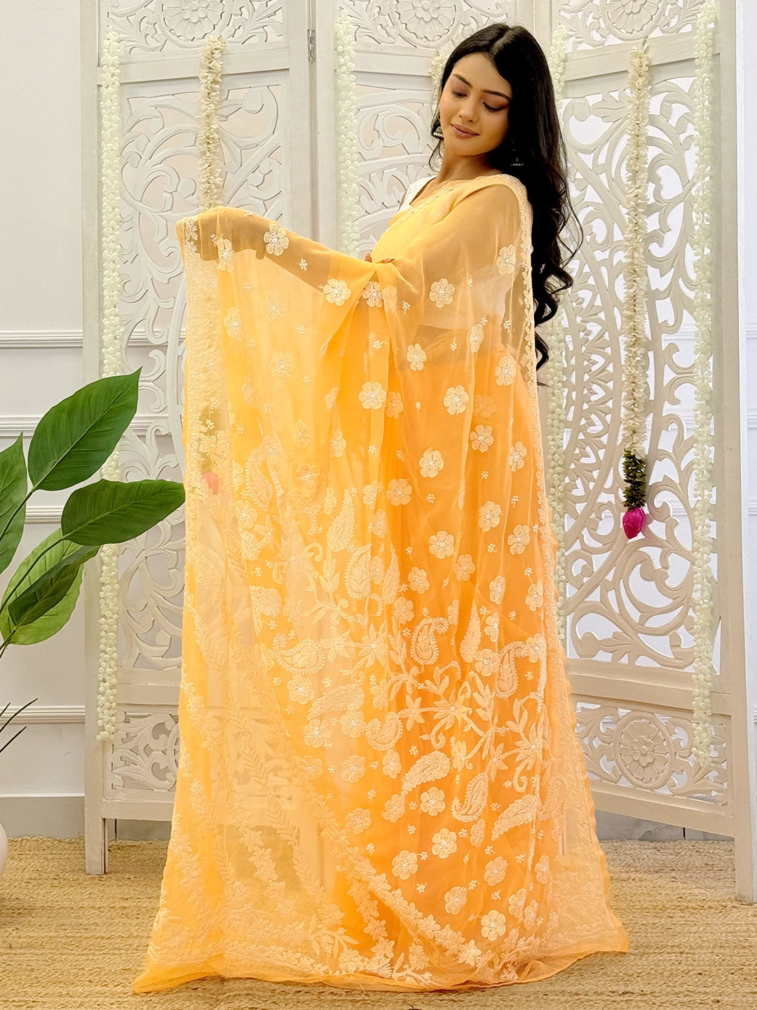 Artisan-made georgette chikankari saree showcasing detailed handcrafted embroidery suitable for festive celebrations.