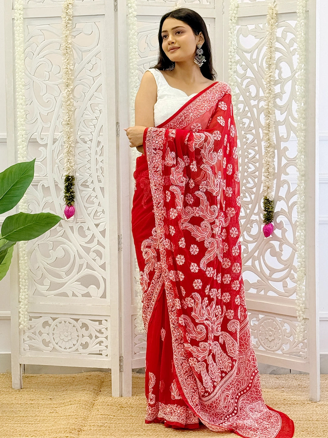 Premium georgette saree with hand-embroidered chikankari patterns ideal for festive wear and cultural events.