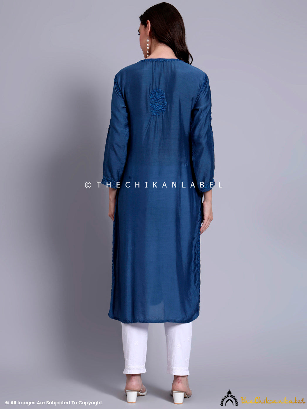 Elegant Indian ethnic outfit showcasing Lucknowi chikankari embroidery on soft muslin kurti with full sleeves and round V-slit neckline.

