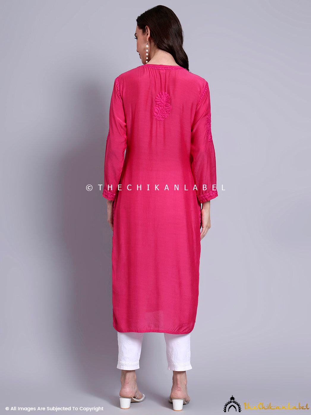 Elegant Indian woman modeling a muslin chikankari kurti with graceful design elements and subtle embroidery perfect for ethnic wardrobes.

