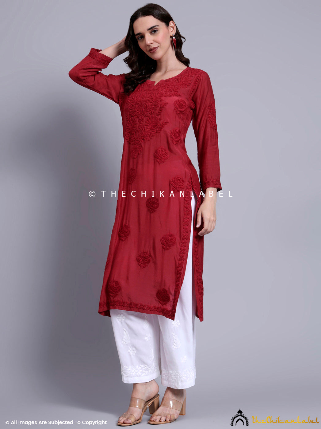 Straight-fit muslin kurti with handcrafted detailing and timeless silhouette, ideal for women seeking elegant and comfortable daily wear.

