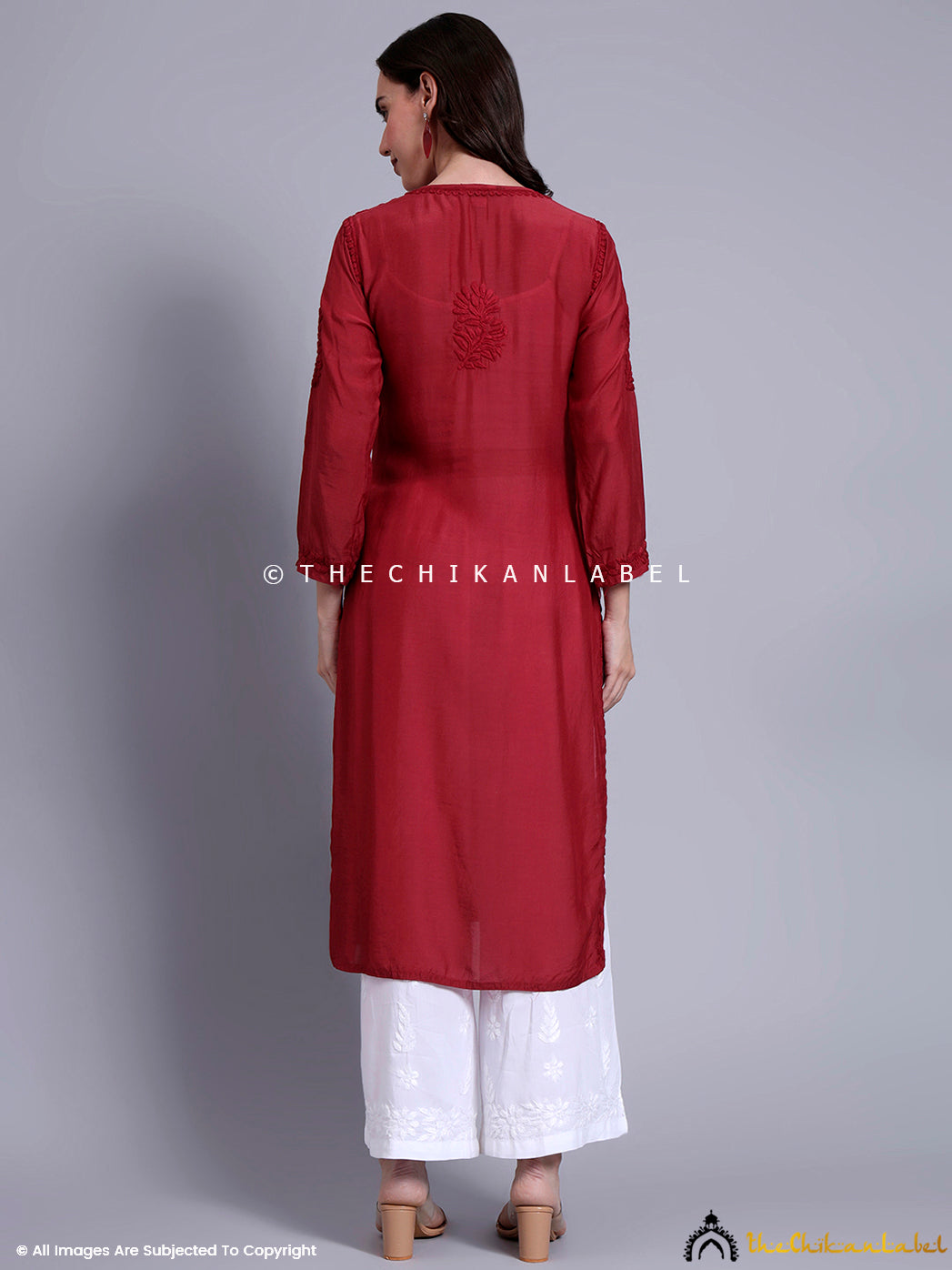 Classic ethnicwear kurti with hand-done floral chikankari patterns on breathable muslin, suitable for professional and casual occasions.

