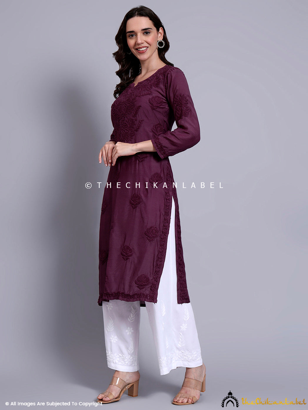 Close-up shot of neckline and chest embroidery on muslin kurti showcasing delicate chikankari craftsmanship.

