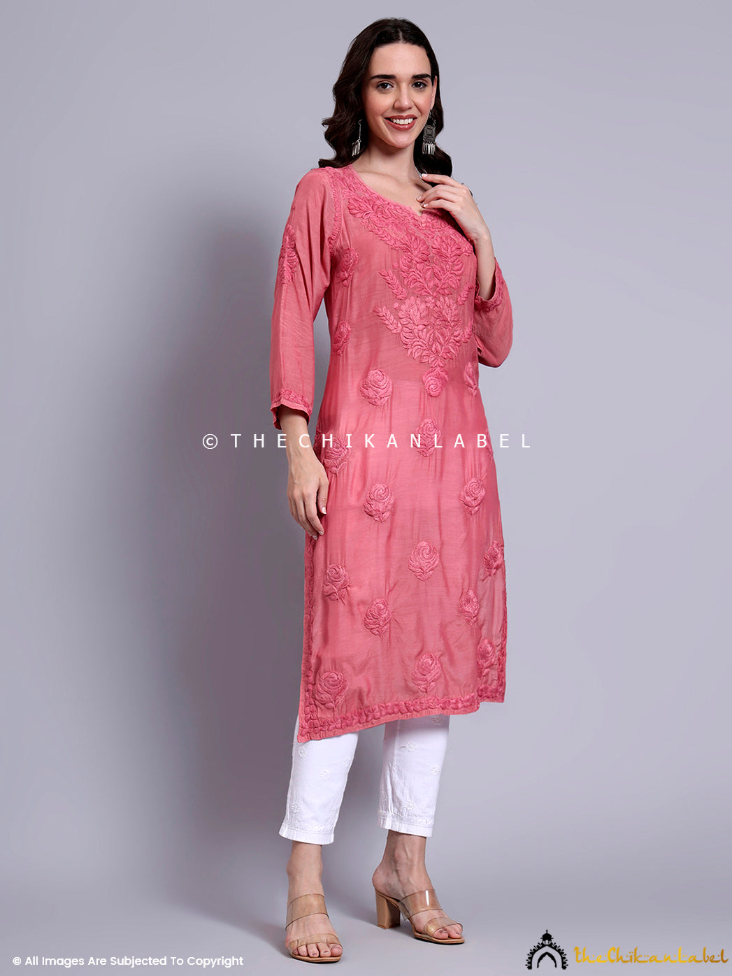 Elegant Indian ethnic outfit showcasing Lucknowi chikankari embroidery on soft muslin kurti with full sleeves and round V-slit neckline.

