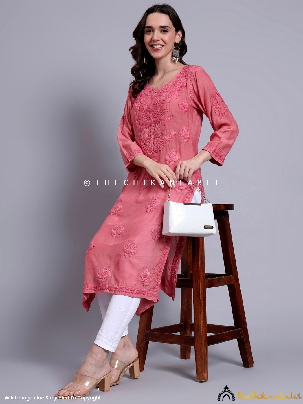 Artisanal muslin straight kurti with side slits and handcrafted embroidery, perfect for festive gatherings, cultural events, and everyday wear.

