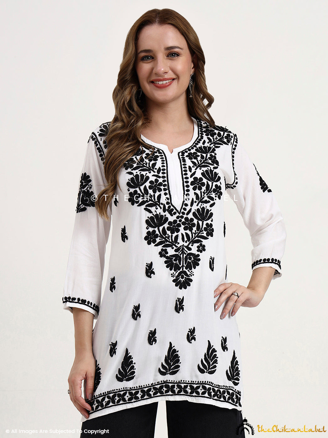 Premium rayon short top for women with hand-embroidered chikankari floral motifs, ideal for ethnic and casual wear styling.