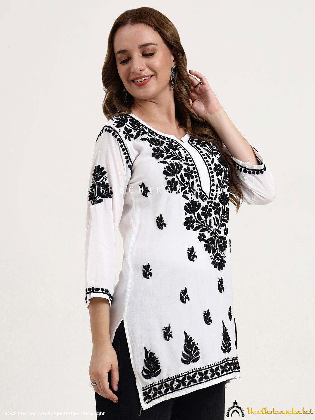 Ethnic wear rayon short kurti top with authentic hand-embroidered chikankari patterns, trending in modern fusion fashion.