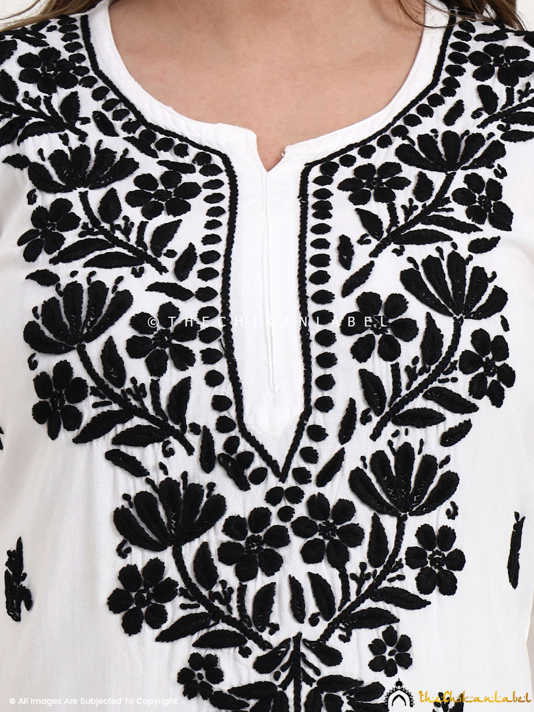 Trending chikankari short kurti top made from lightweight rayon fabric, designed for festive occasions and everyday comfort.