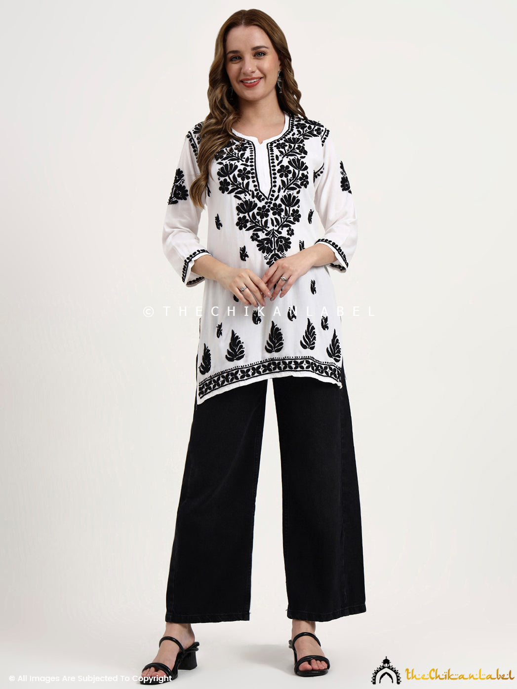 Comfortable rayon short kurti with traditional chikankari work, handcrafted by skilled artisans from Lucknow.