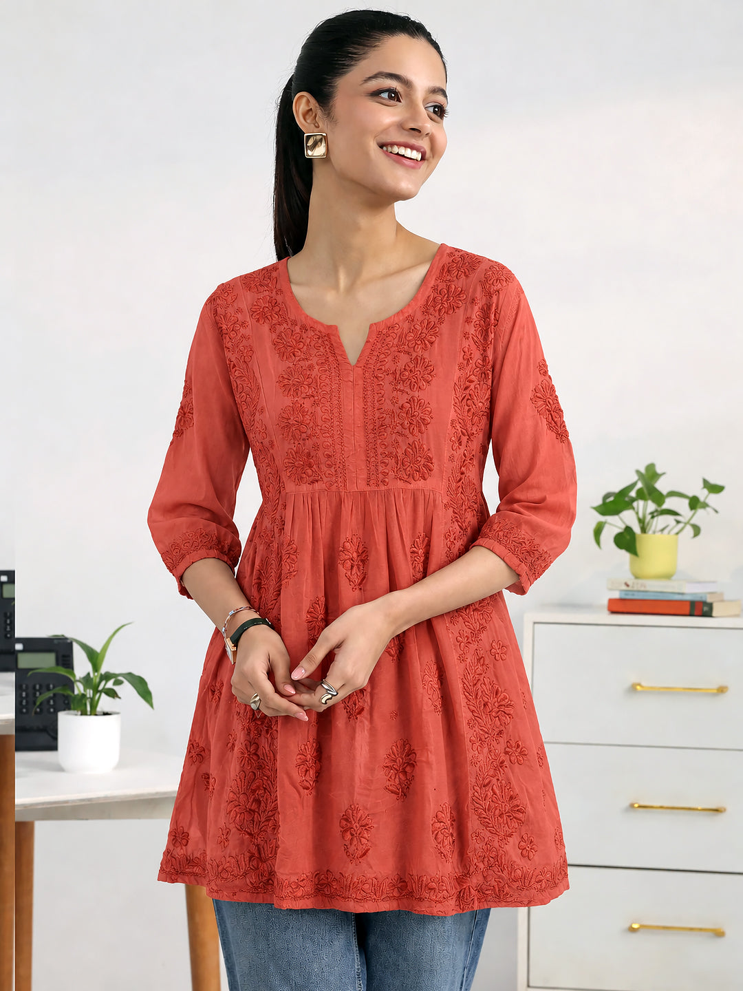 Sara Viscose Silk Kurti showcasing detailed floral Chikankari embroidery across the front panel, embroidered borders, and a contemporary short kurti silhouette.