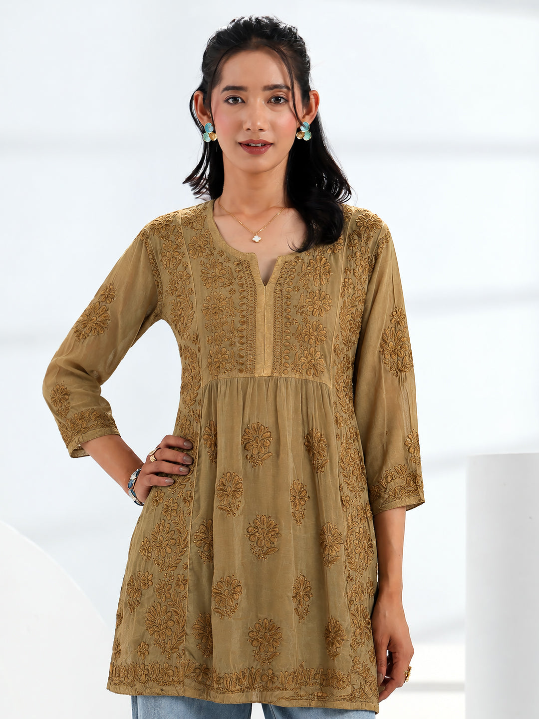 Sara Viscose Silk Short A-Line Kurti featuring intricate floral Chikankari embroidery, elegant V-slit neckline, three-quarter sleeves, and a graceful flared silhouette for women.