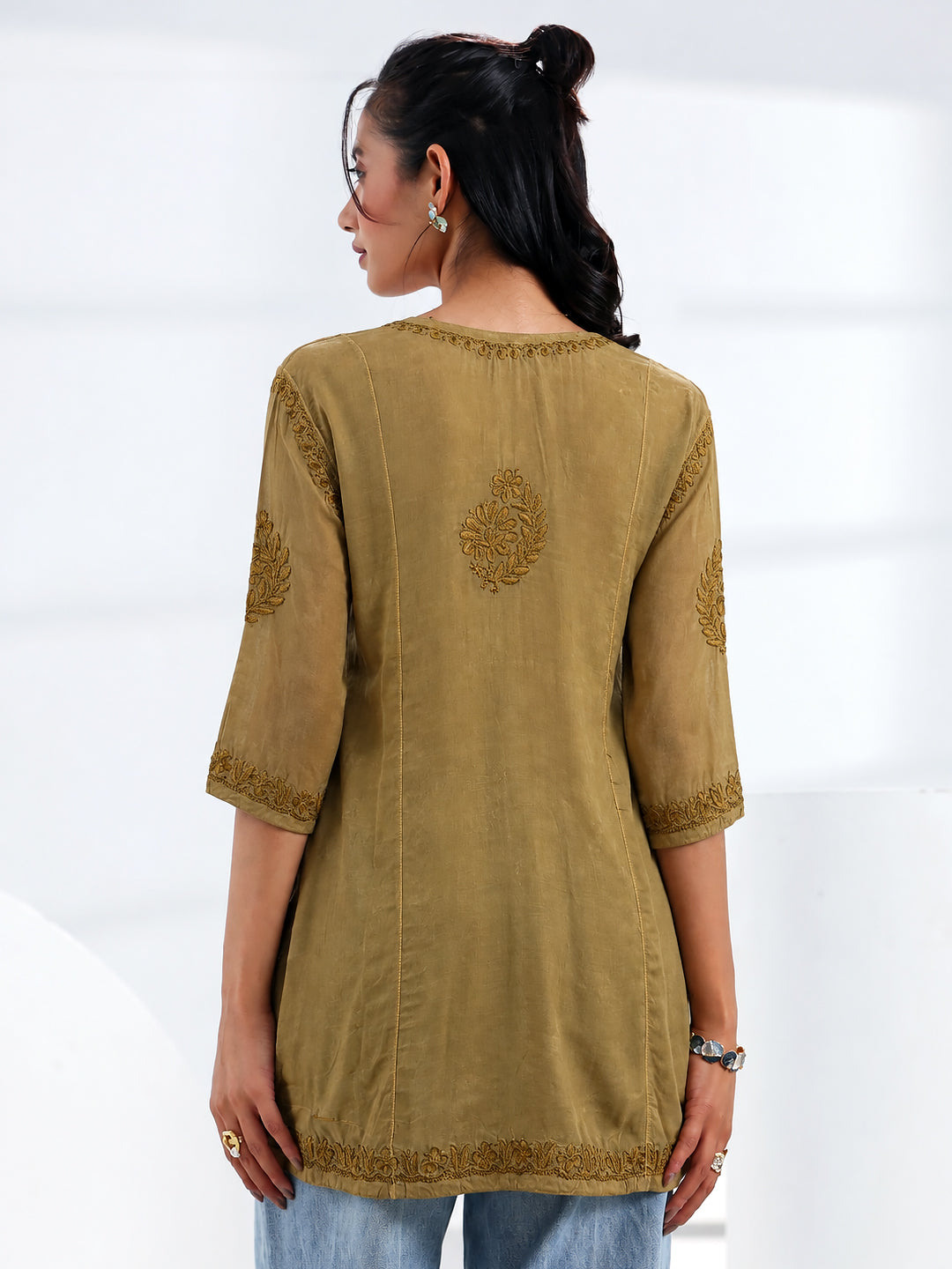 Sara Chikankari short kurti for women featuring traditional floral threadwork, a beautifully embroidered front yoke, three-quarter sleeves, and an elegant ethnic silhouette.