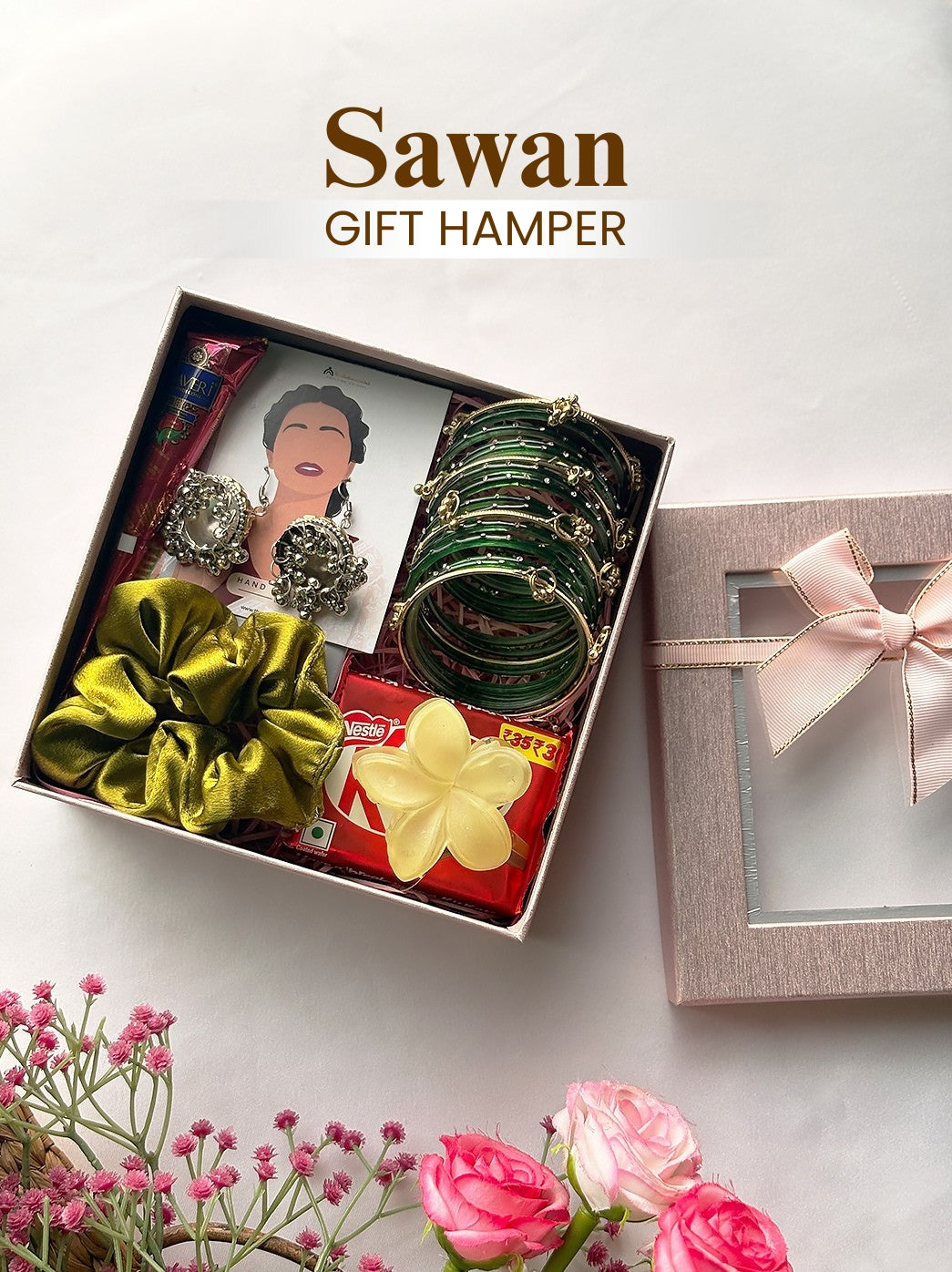 Sawan gift hamper for women featuring a bangles set, oxidised earrings, mehndi cone, bindi, satin scrunchie, chocolate and flower claw clip.