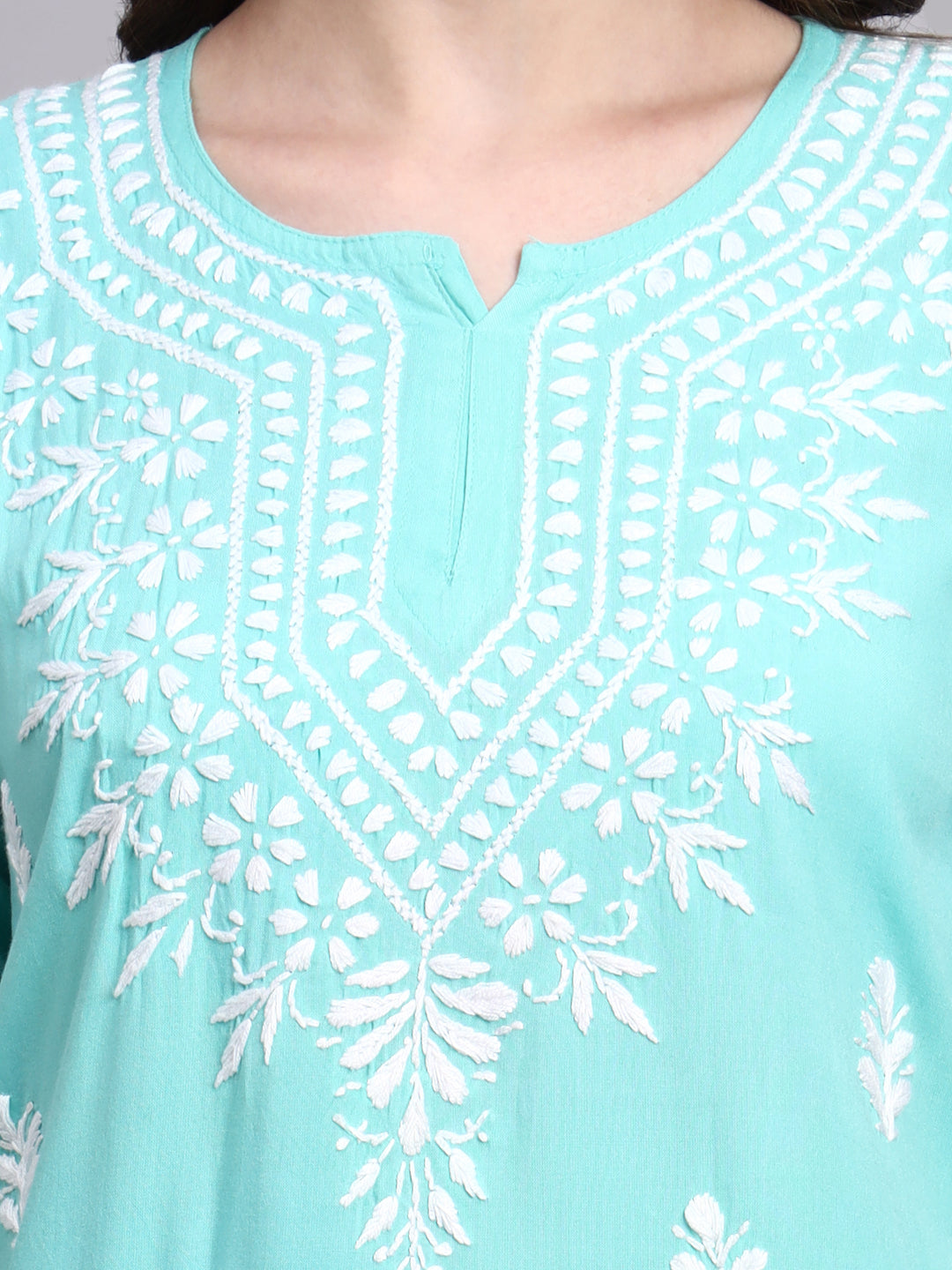 Rayon short kurta with handcrafted chikankari embroidery featuring floral motifs and traditional neckline detailing