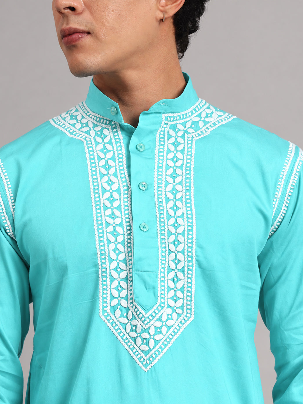 Front view of the Uman Mens Kurta highlighting the symmetrical neckline embroidery, short button placket and straight silhouette falling around the knees.