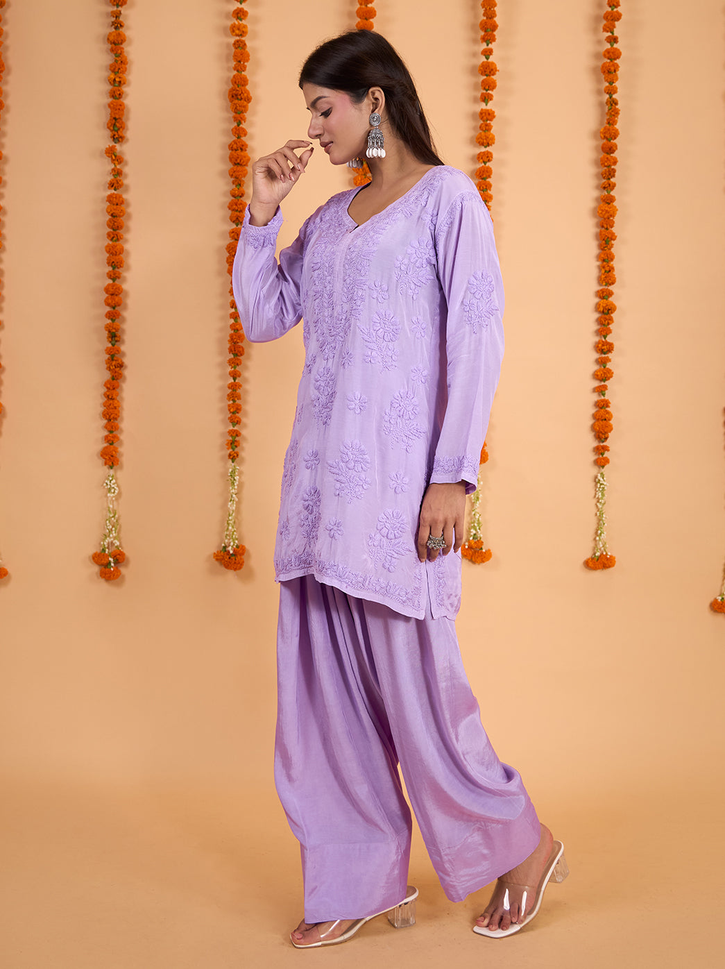 Front view of the Shagun Muslin Short Kurti Farshi Set, showing tonal floral embroidery across the kurti and the generous drape of the matching pants.

