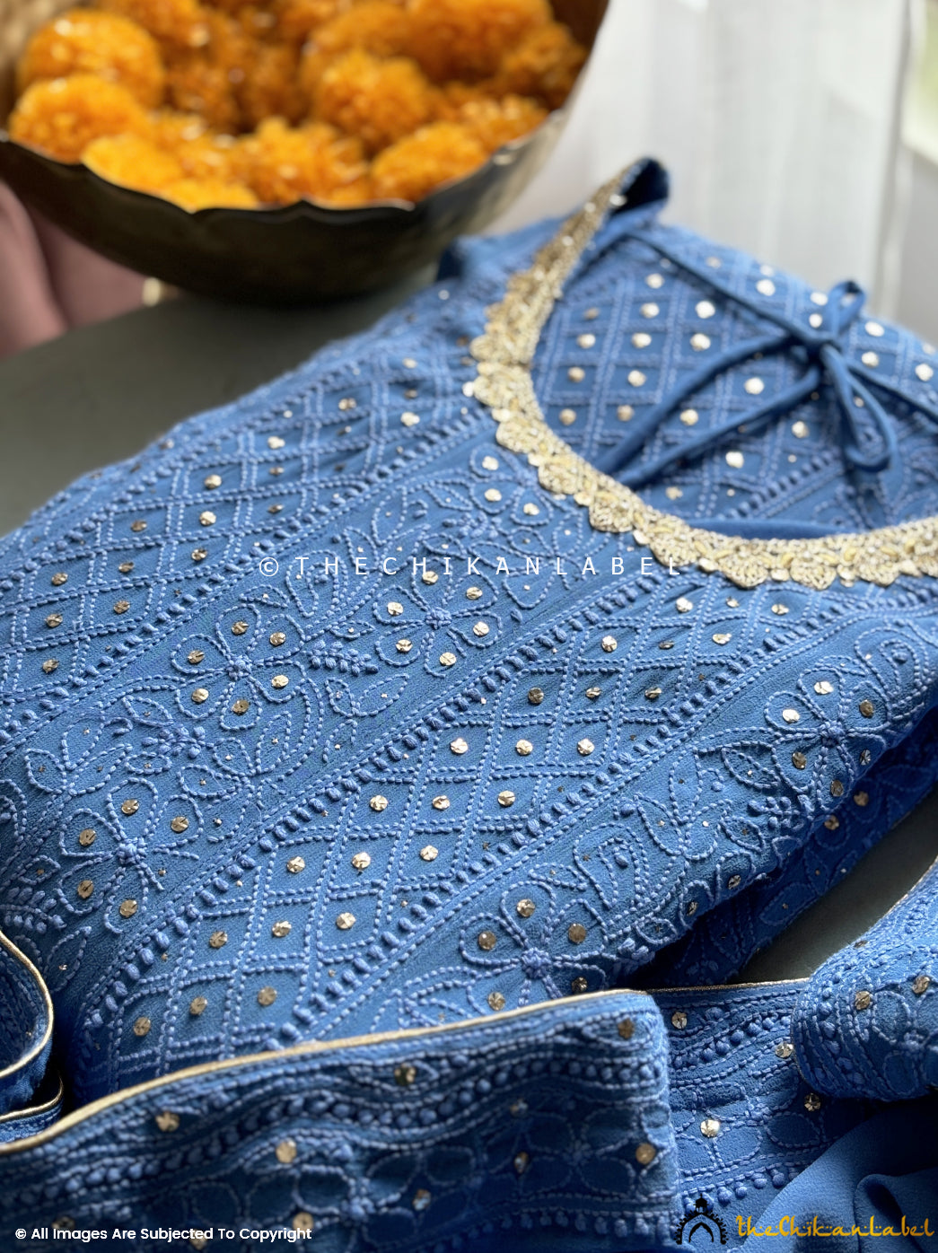 Ethnic designer wear with luxurious chikankari showcasing traditional craftsmanship and elegance

