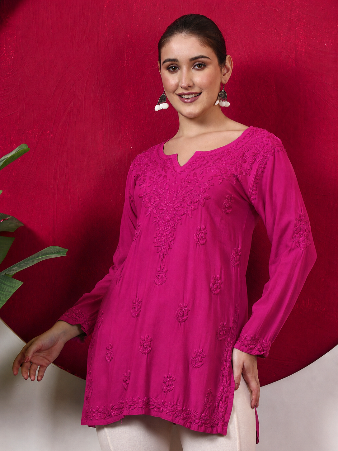 Female fashion model wearing a trending Chikankari top with intricate embroidery, full-length sleeves and soft rayon fabric, designed for comfortable everyday ethnic dressing.
